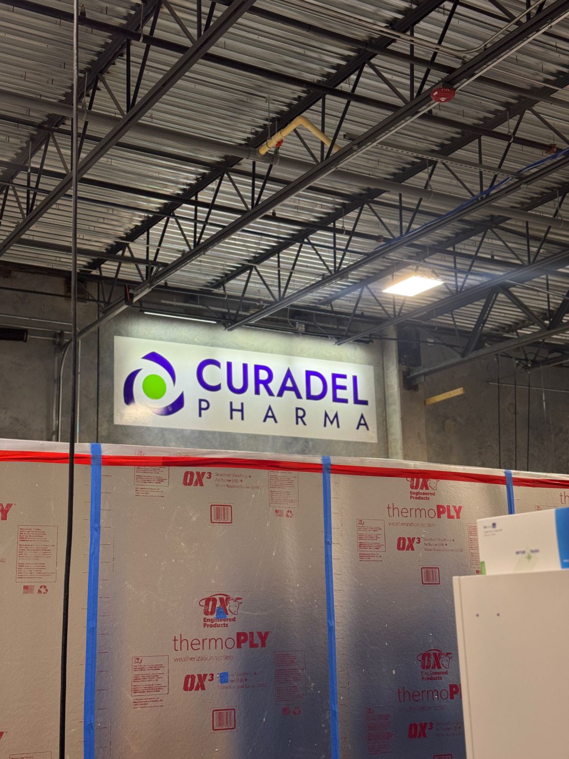 Curadel Pharma sign inside the Bonita Springs facility