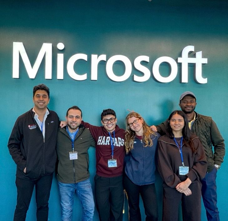 The six-person UpstreamX.ai team standing together at the Harvard HSIL Hackathon