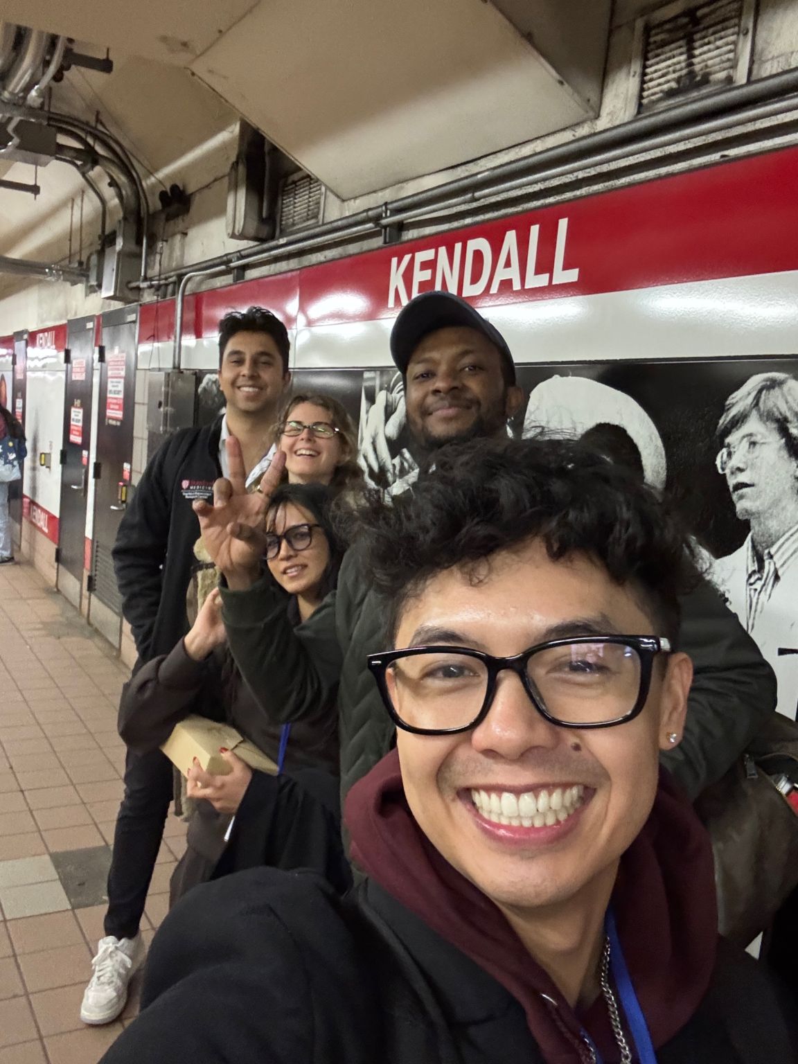 UpstreamX.ai teammates celebrating together at Kendall station after the hackathon